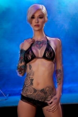Hot tattooed Kleio Valentien sheds black lace panties to squat & spread legs on dochick.com