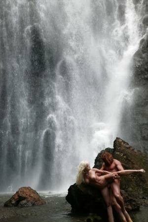 Stunning milf Jesse Jane fucks outdoor in the waterfall on cam on dochick.com