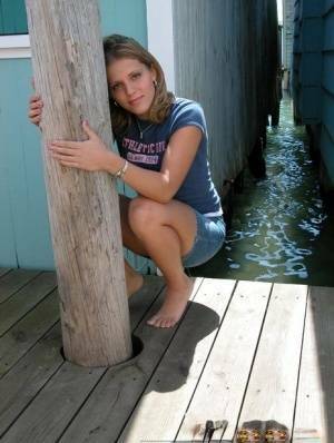 Blonde solo girl flashes upskirt panties on lakeside boardwalk on dochick.com