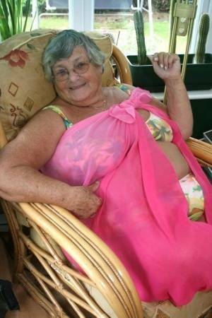 Horny old granny in glasses disrobes to reveal huge saggy tits & big BBW ass on dochick.com