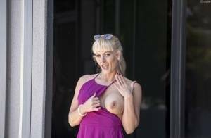 Naughty blonde flashes no panty upskirts and her big tits out in public on dochick.com
