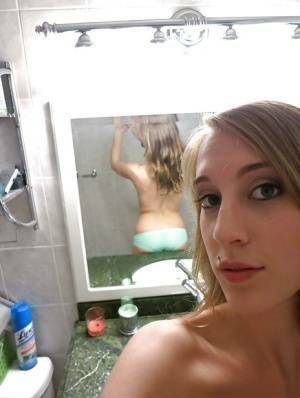 Smiley amateur Cadence Lux stripping and picturing herself in the bath on dochick.com