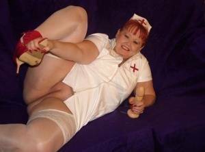 Mature redheaded nurse Valgasmic Exposed exposes herself during dildo play on dochick.com