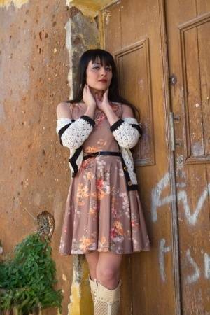 Asian model Sophia Jade flashes her upskirt panties on a cobblestone street on dochick.com