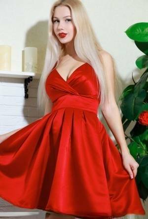 Nice blonde teen Genevieve Gandi removes red dress to display her trimmed muff on dochick.com
