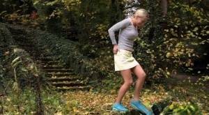 Cute blonde Victoria Pure hikes her skirt to take a pee along country lane on dochick.com