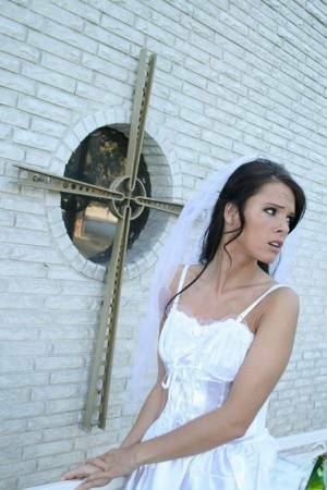 MILF babe in bride's dress Jennifer Dark spreading pussy on dochick.com