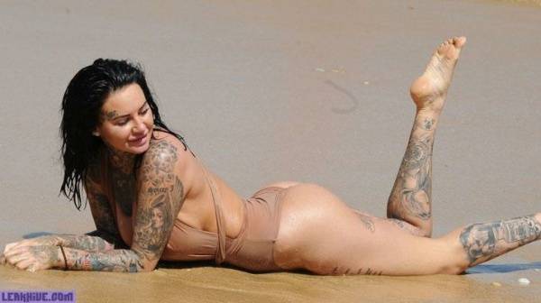 Jemma Lucy showing her ass and cleavage on the beach on dochick.com
