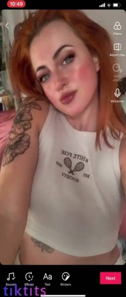 Redheaded bitch with pretty freckles showed her size 34H TikTok tits on dochick.com