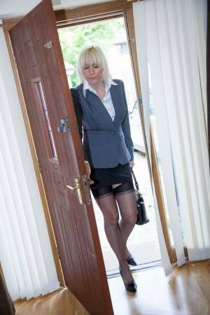 Older MILF Jan Burton strips off business clothes after a hard day at office on dochick.com