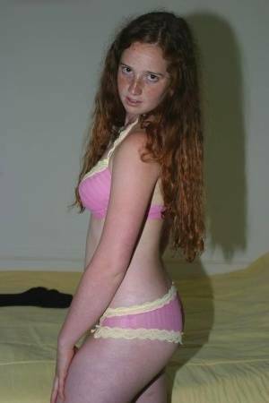 Flexible redhead Rachel showcases her natural pussy after lingerie removal on dochick.com