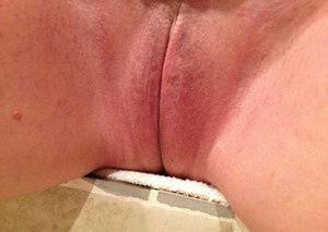 Older amateur Busty Bliss finger spreads her pink vagina after showering on dochick.com