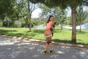 Latina solo girl Carolina Abril shedding shorts to expose nice ass outdoors on dochick.com