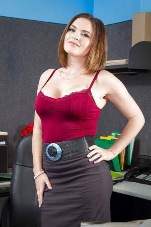 Secretary Krissy Lynn shows her fuckable booty in the office on dochick.com