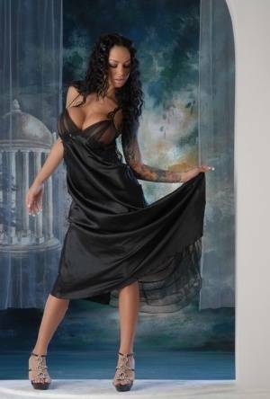 Leggy Latina chick Angelina Valentine removes a long black dress to pose nude on dochick.com