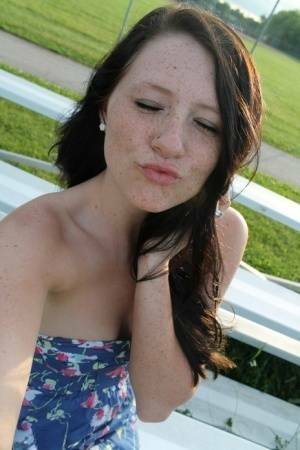 Teen solo girl Freckles 18 exposes her upskirt panties at a ball diamond on dochick.com