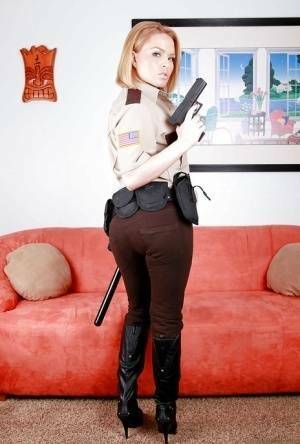 Hot babe in police uniform Krissy Lynn stripping and spreading her legs on dochick.com