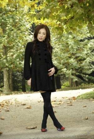 Fully clothed Japanese teen models in the park in black clothes and stockings - Japan on dochick.com
