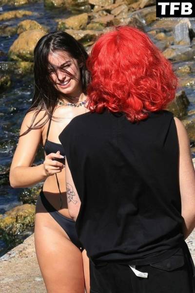Addison Rae Displays Her Curves in a Black Bikini on Holiday with Omer Fedi on Lake Como on dochick.com