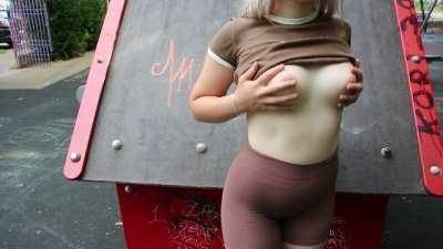Public flashing in a park with people around on dochick.com