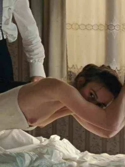 Keira Knightley getting spanked with her tits out on dochick.com