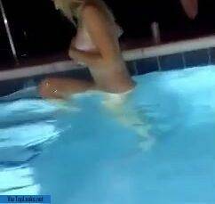 Unhinged teen jumps into pool topless on dochick.com