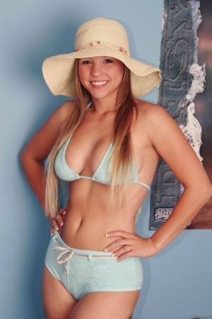 Solo girl Dawson Miller takes off her bikini while wearing a floppy sun hat on dochick.com