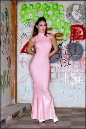 Latina beauty Ryan Keely inserts a vibrator after removing a long latex dress on dochick.com